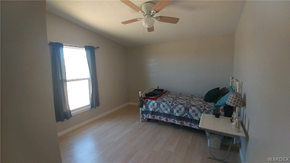3634 Bibo Road Golden Valley, AZ 86413 - Photo 12 of 44 a room with a bed and a window