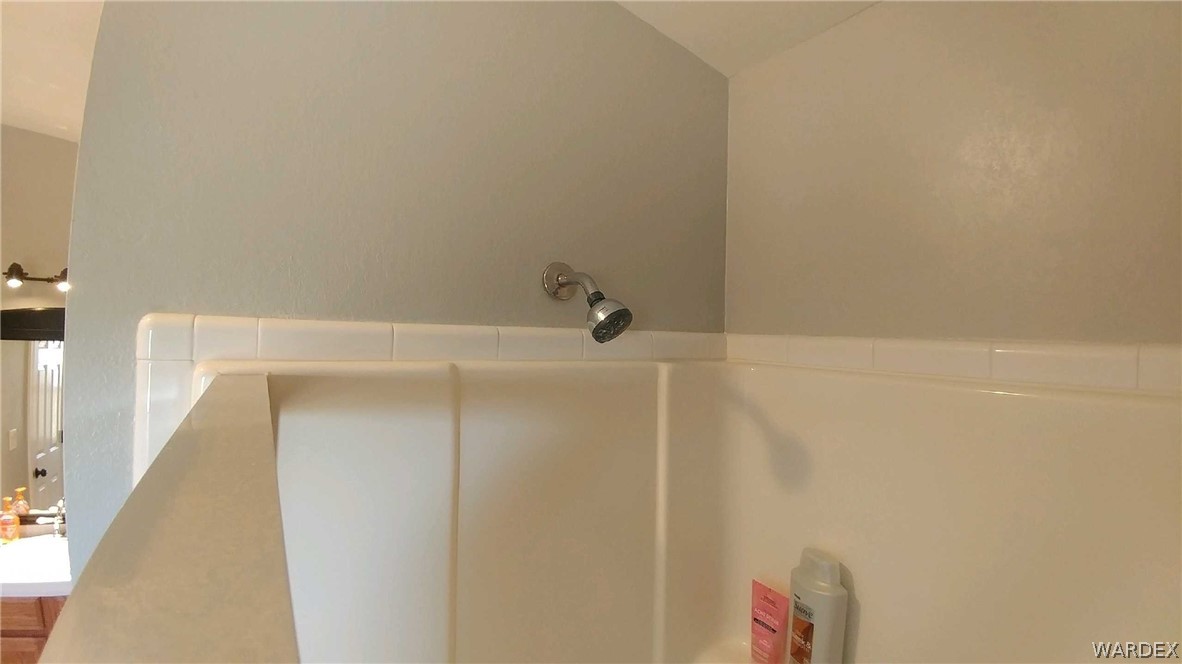 3634 Bibo Road Golden Valley, AZ 86413 - Photo 17 of 44 a bathroom with a shower