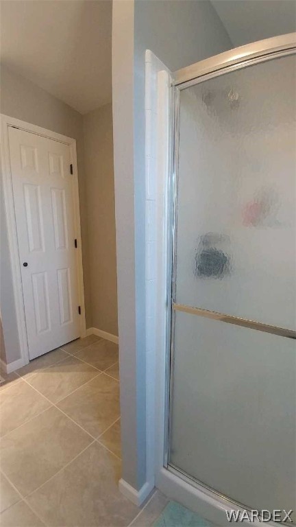 3634 Bibo Road Golden Valley, AZ 86413 - Photo 18 of 44 a bathroom with a glass shower door