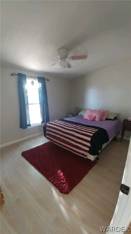 3634 Bibo Road Golden Valley, AZ 86413 - Photo 31 of 44 a bedroom with a bed and window