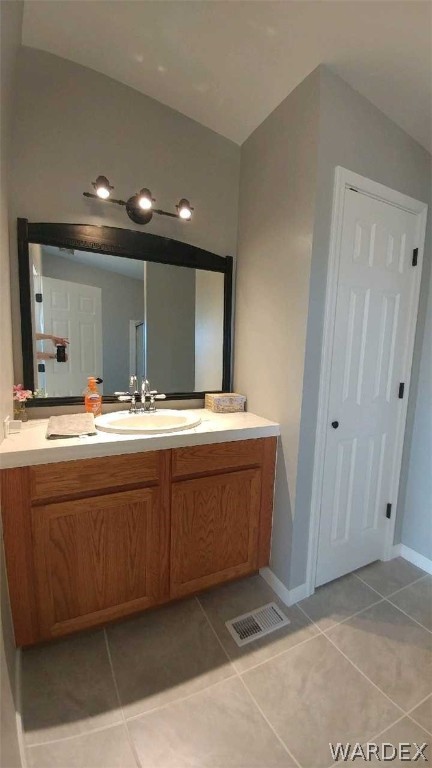 3634 Bibo Road Golden Valley, AZ 86413 - Photo 38 of 44 a bathroom with a sink and a mirror