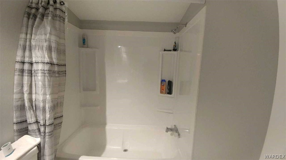 3634 Bibo Road Golden Valley, AZ 86413 - Photo 40 of 44 a bathroom with a shower