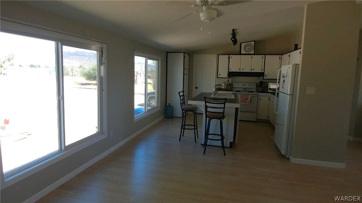 3634 Bibo Road Golden Valley, AZ 86413 - Photo 41 of 44 a dining room with furniture and a window