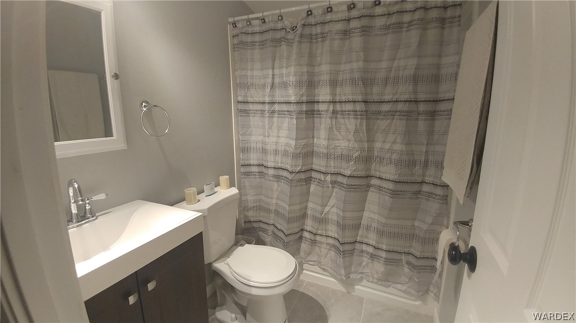 3634 Bibo Road Golden Valley, AZ 86413 - Photo 43 of 44 a bathroom with a sink toilet and shower