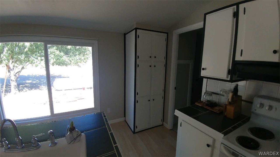 3634 Bibo Road Golden Valley, AZ 86413 - Photo 8 of 44 a kitchen with a refrigerator and a stove