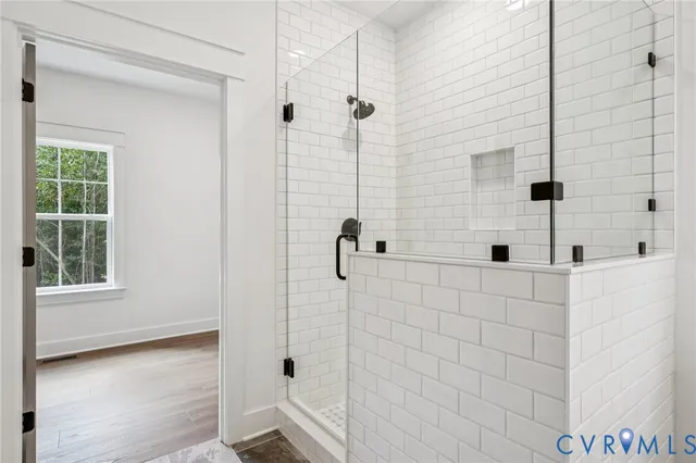 a bathroom with a bathtub and shower