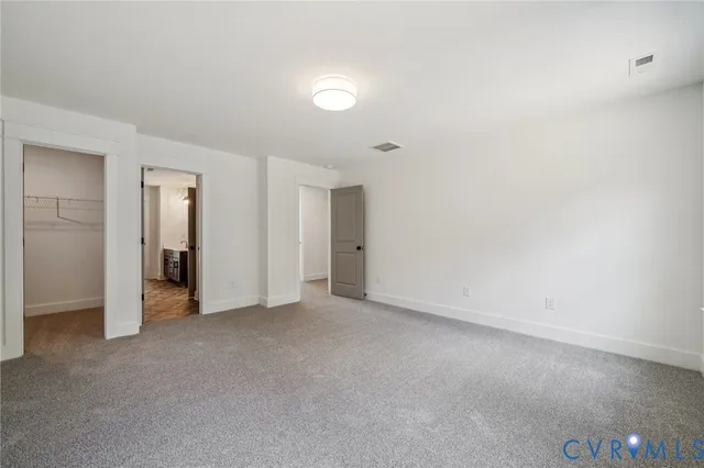 an empty room with closet area