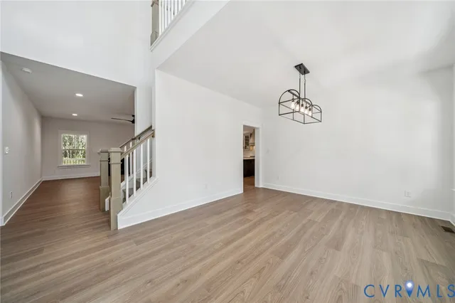 a view of an entryway with wooden floor