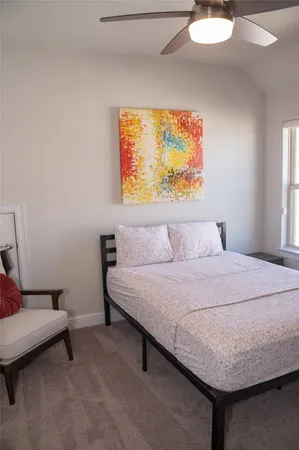 a bedroom with a bed and couch