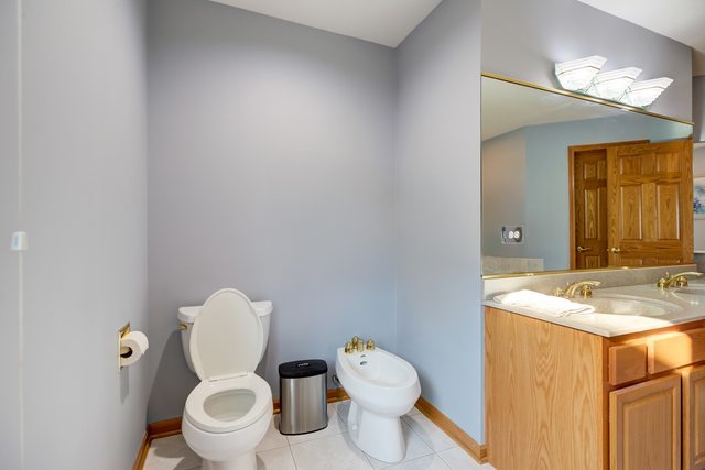 206 Meier Road Arlington Heights, IL 60005 - Photo 30 of 42 a white toilet sitting next to a bathroom sink