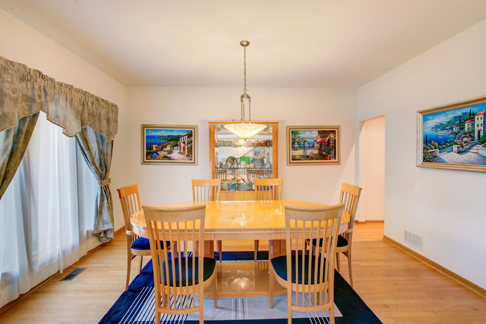 206 Meier Road Arlington Heights, IL 60005 - Photo 8 of 42 a view of a dining room with furniture window and wooden floor