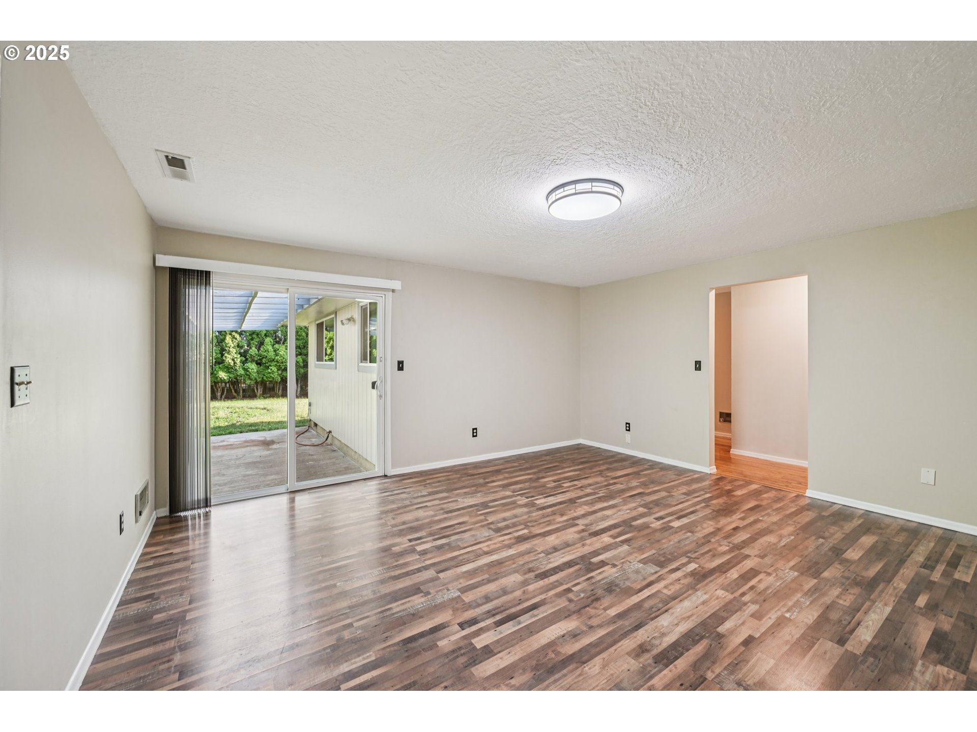 1631 North Clark Street Cornelius, OR 97113 - Photo 12 of 29 a view of empty room with wooden floor and fan