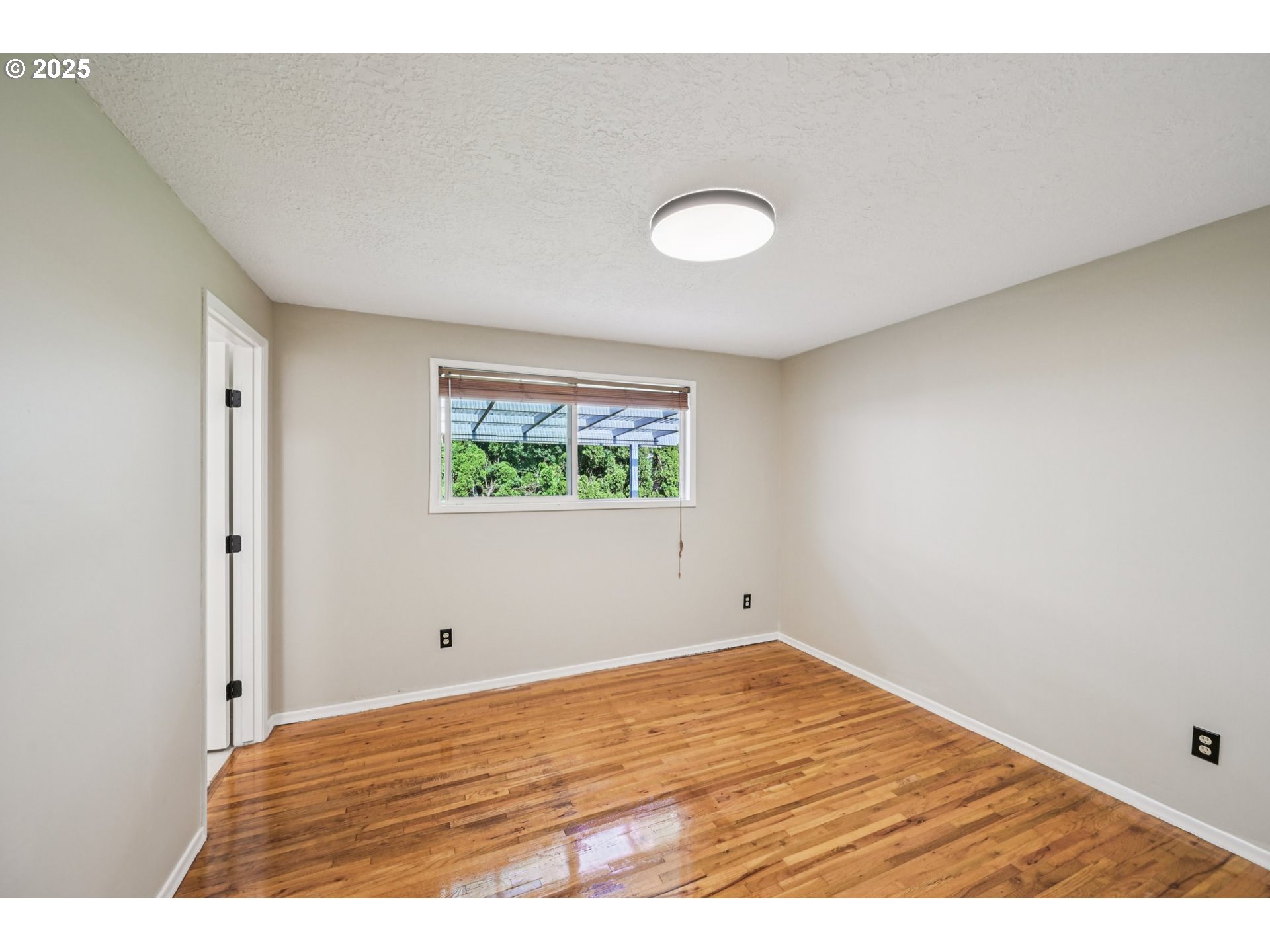 1631 North Clark Street Cornelius, OR 97113 - Photo 16 of 29 a view of empty room with wooden floor