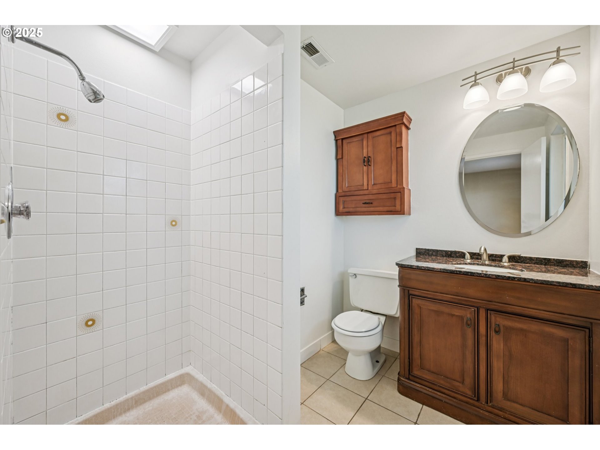 1631 North Clark Street Cornelius, OR 97113 - Photo 17 of 29 a bathroom with a granite countertop toilet a sink and a mirror