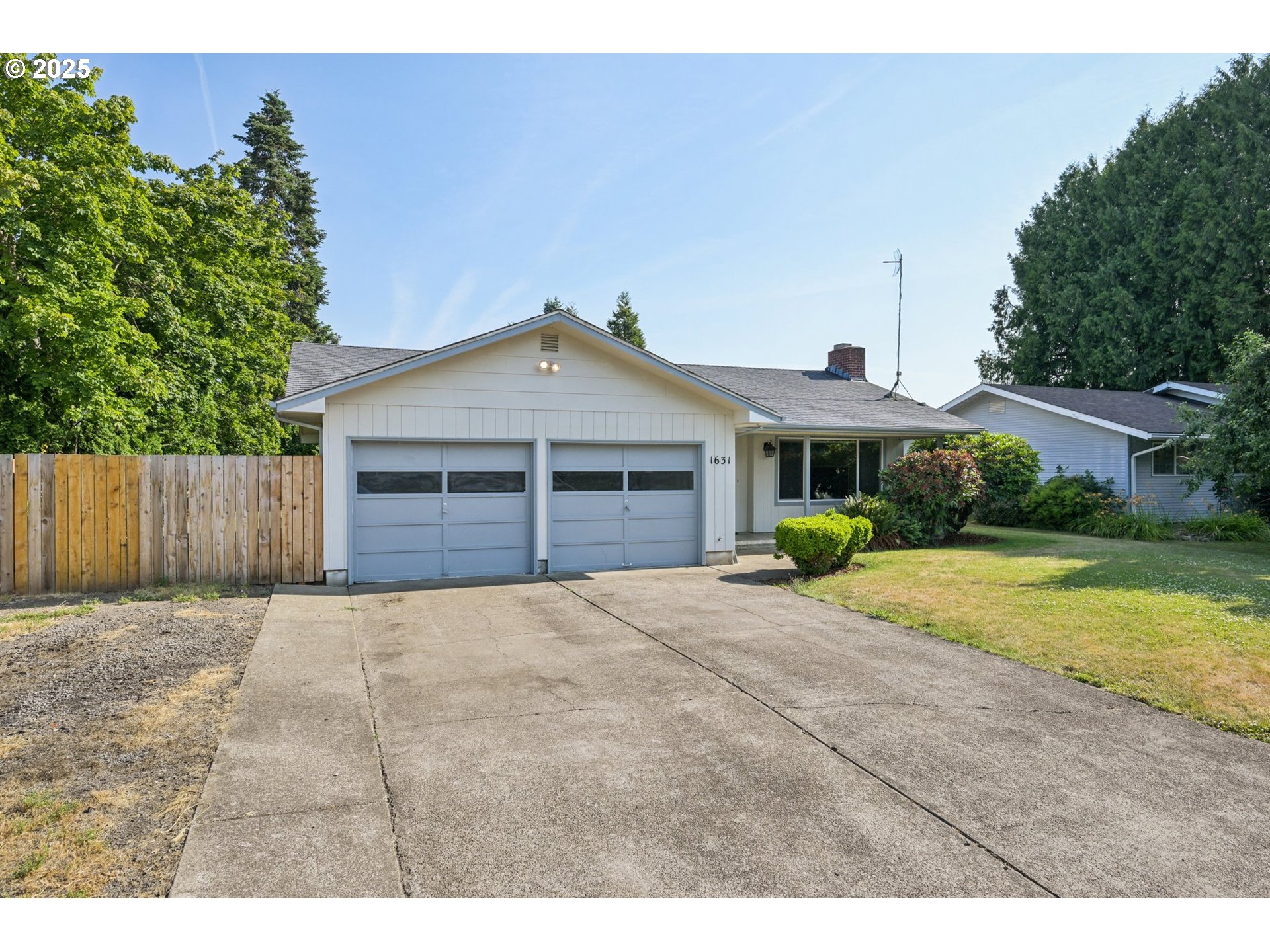 1631 North Clark Street Cornelius, OR 97113 - Photo 2 of 29 a front view of a house with a yard and garage