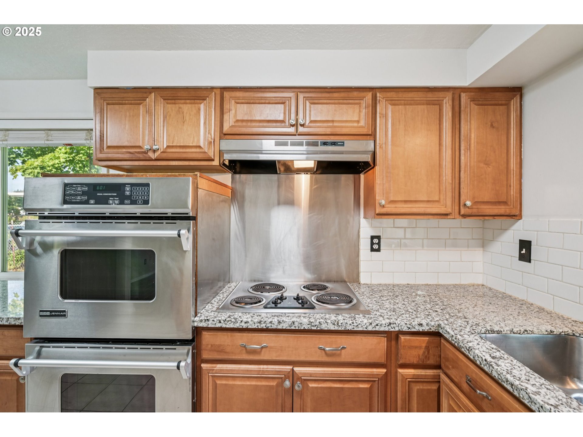 1631 North Clark Street Cornelius, OR 97113 - Photo 7 of 29 a kitchen with granite countertop a stove and a sink