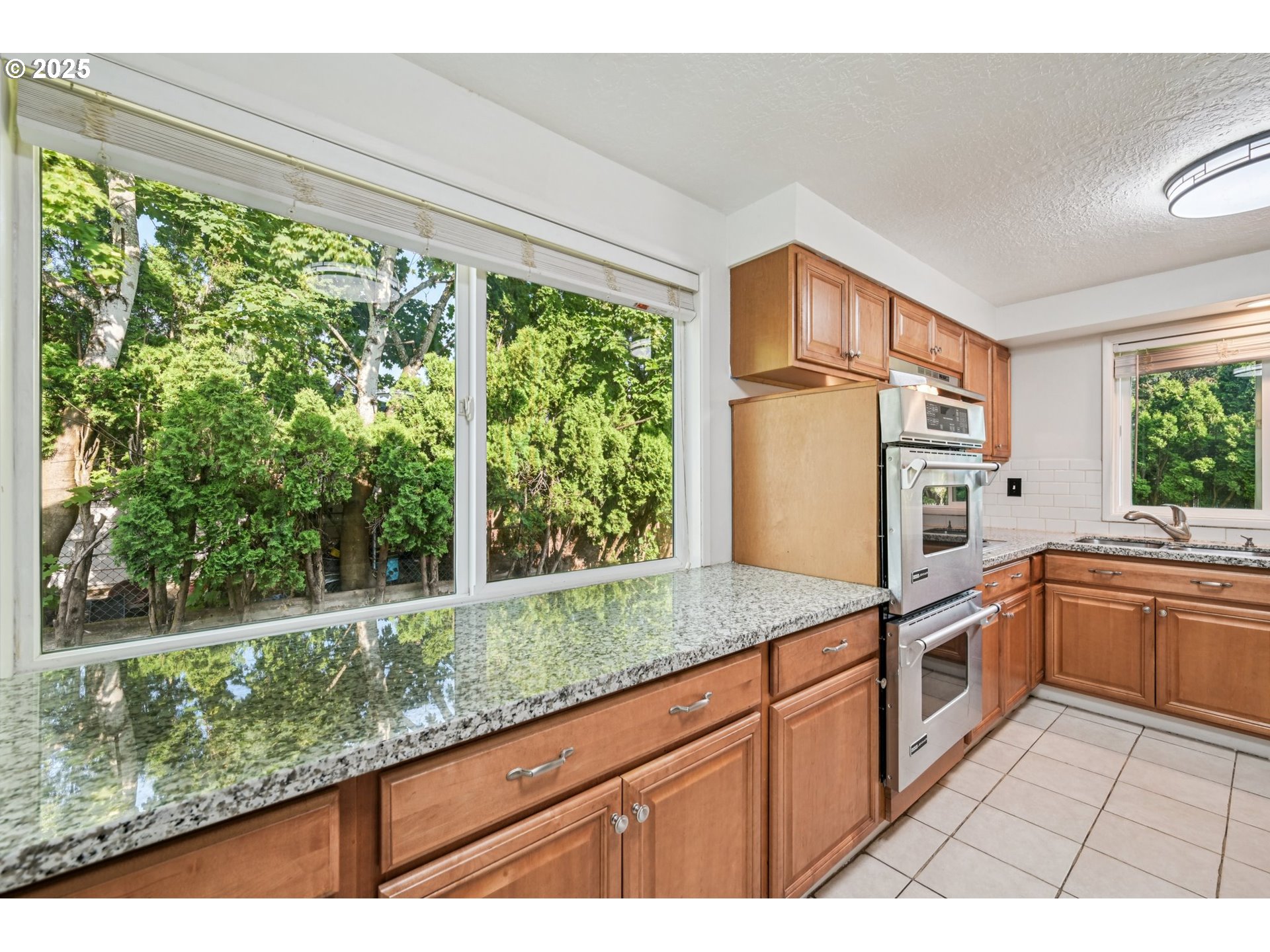 1631 North Clark Street Cornelius, OR 97113 - Photo 9 of 29 a kitchen with granite countertop a window and a sink