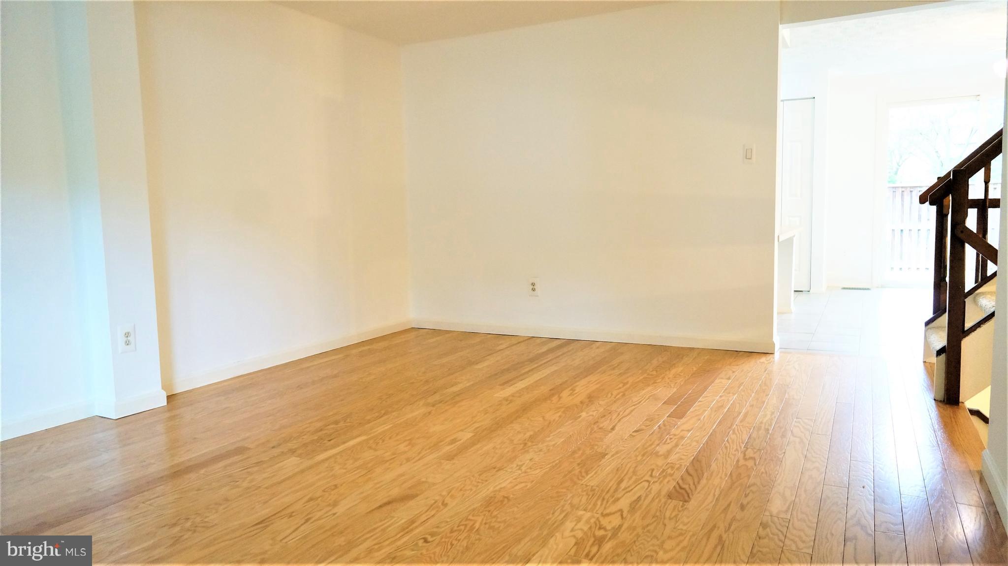Gleaming Hardwood Floors in Dining Room Area