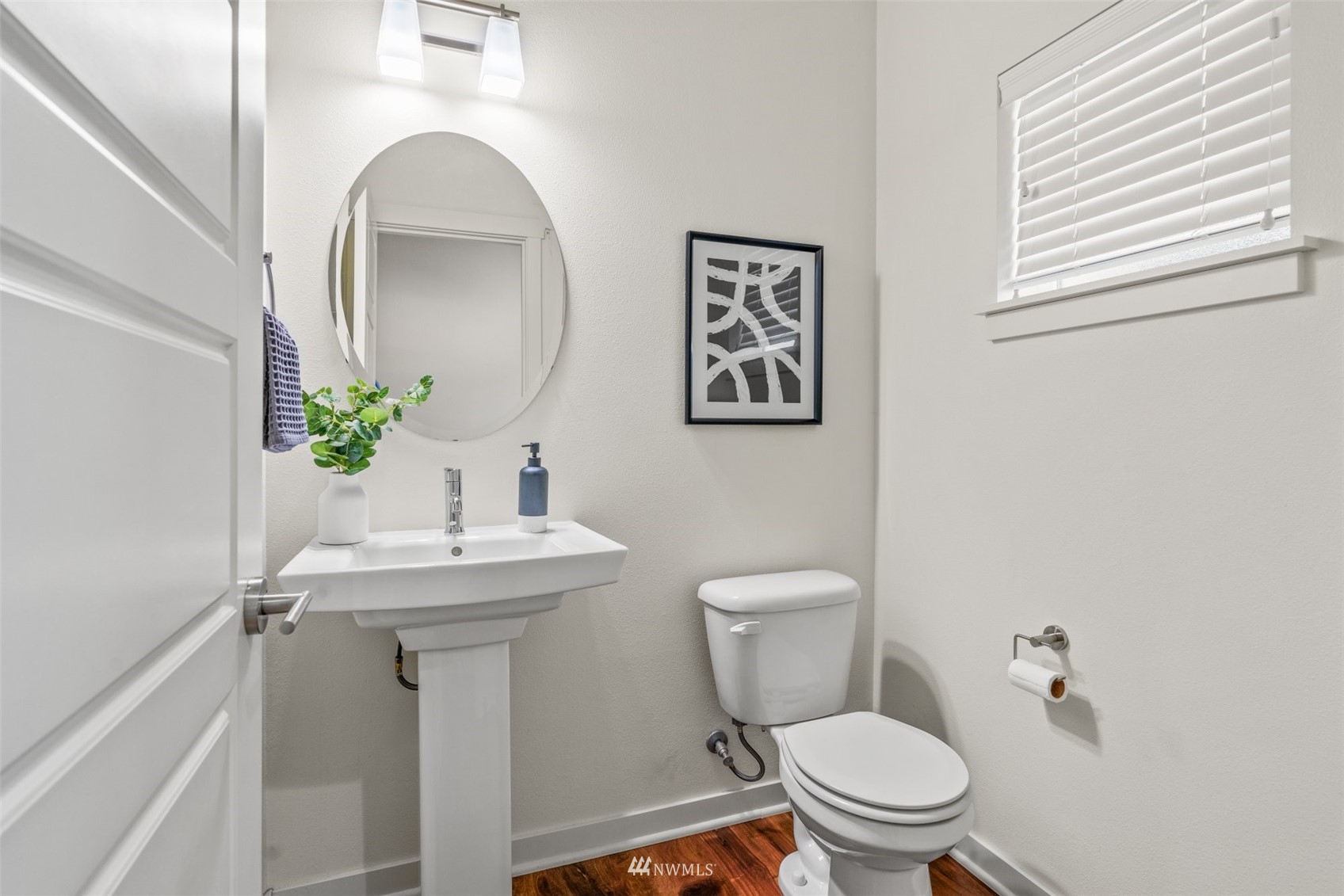 19833 3rd Avenue Southeast Bothell, WA 98012 - Photo 14 of 27 a bathroom with a toilet sink and mirror