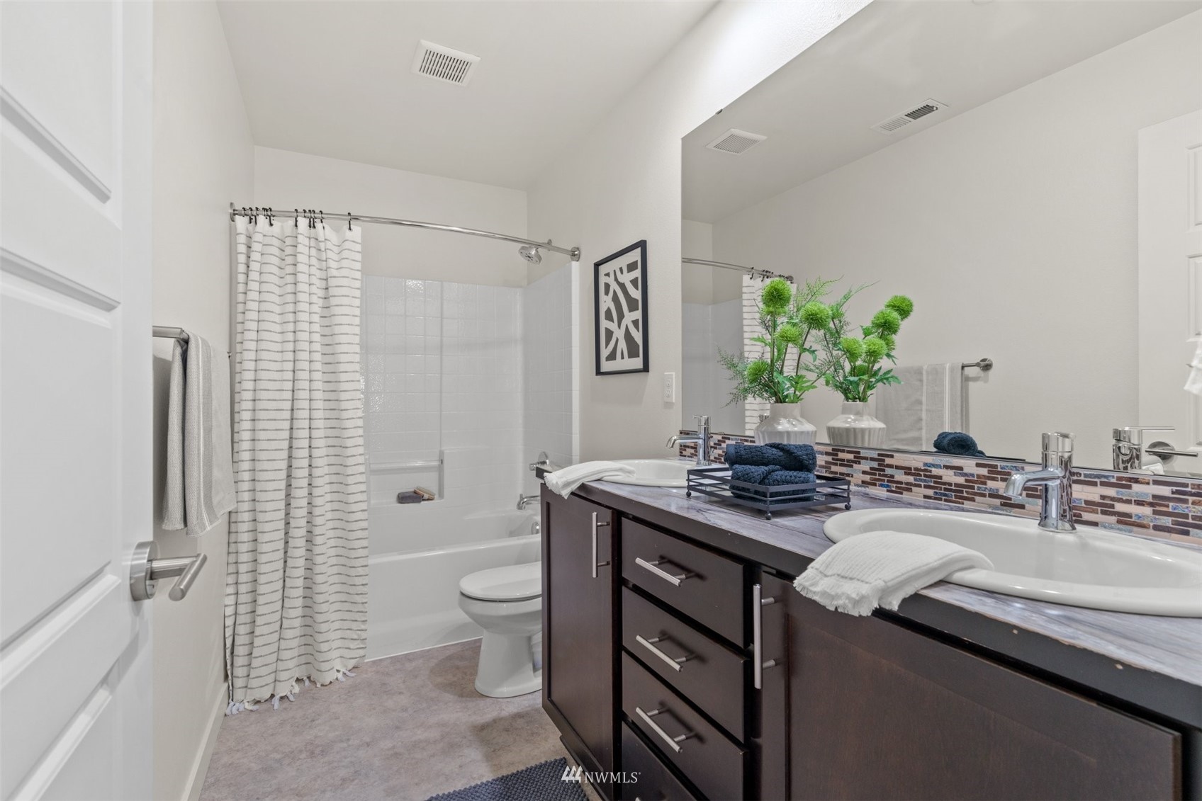 19833 3rd Avenue Southeast Bothell, WA 98012 - Photo 22 of 27 a bathroom with a granite countertop sink a toilet a mirror and shower