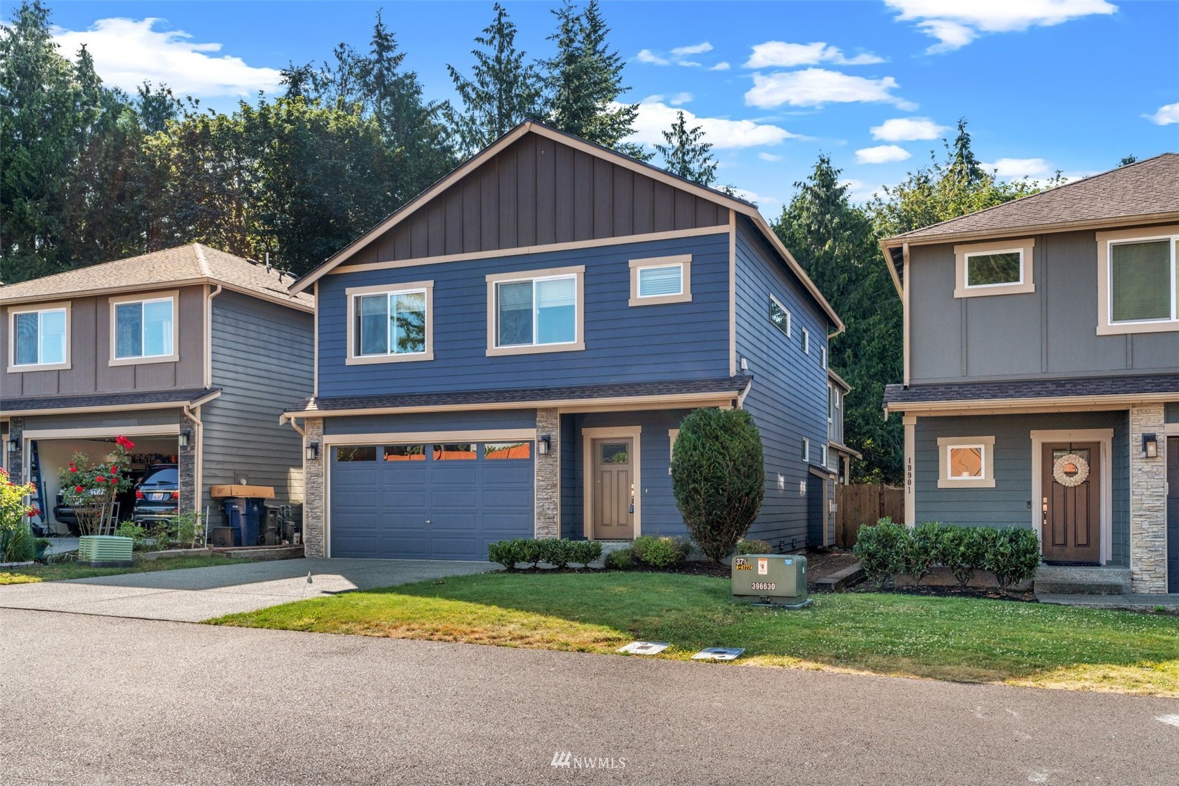 19833 3rd Avenue Southeast Bothell, WA 98012 - Photo 27 of 27 a front view of a house with a yard and garage