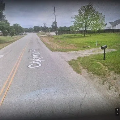 a view of a lake with a yard