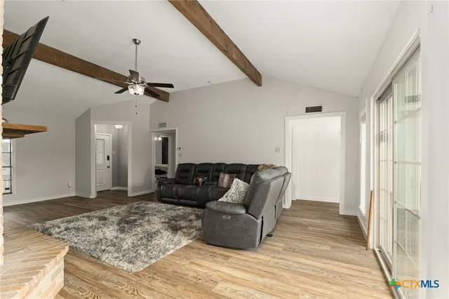 a large kitchen with a table and chairs