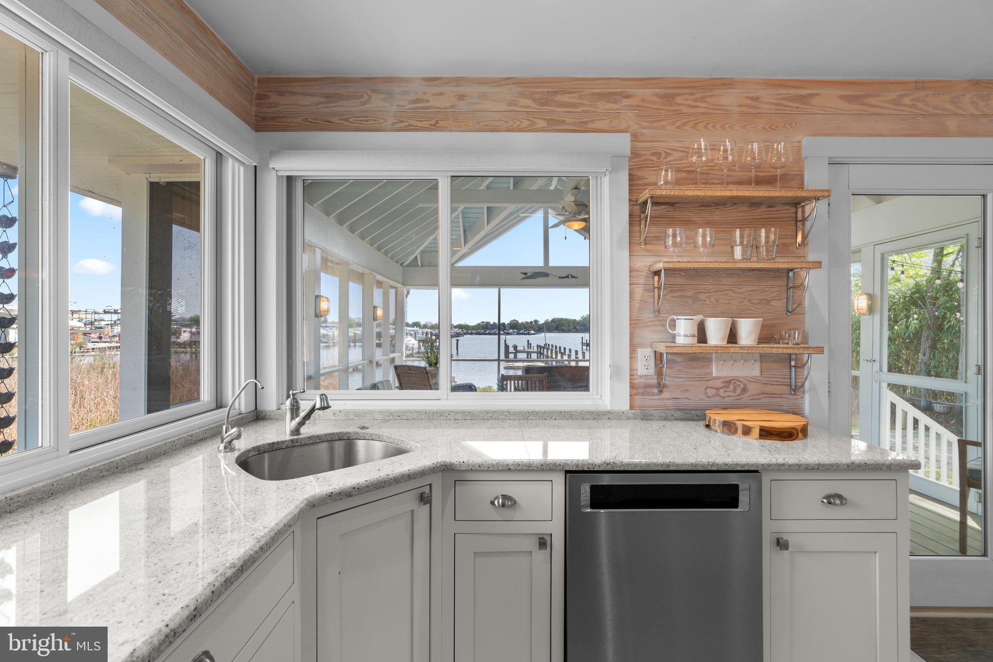 1080 Mayo Road Edgewater, MD 21037 - Photo 14 of 57 a kitchen with granite countertop a sink and a window