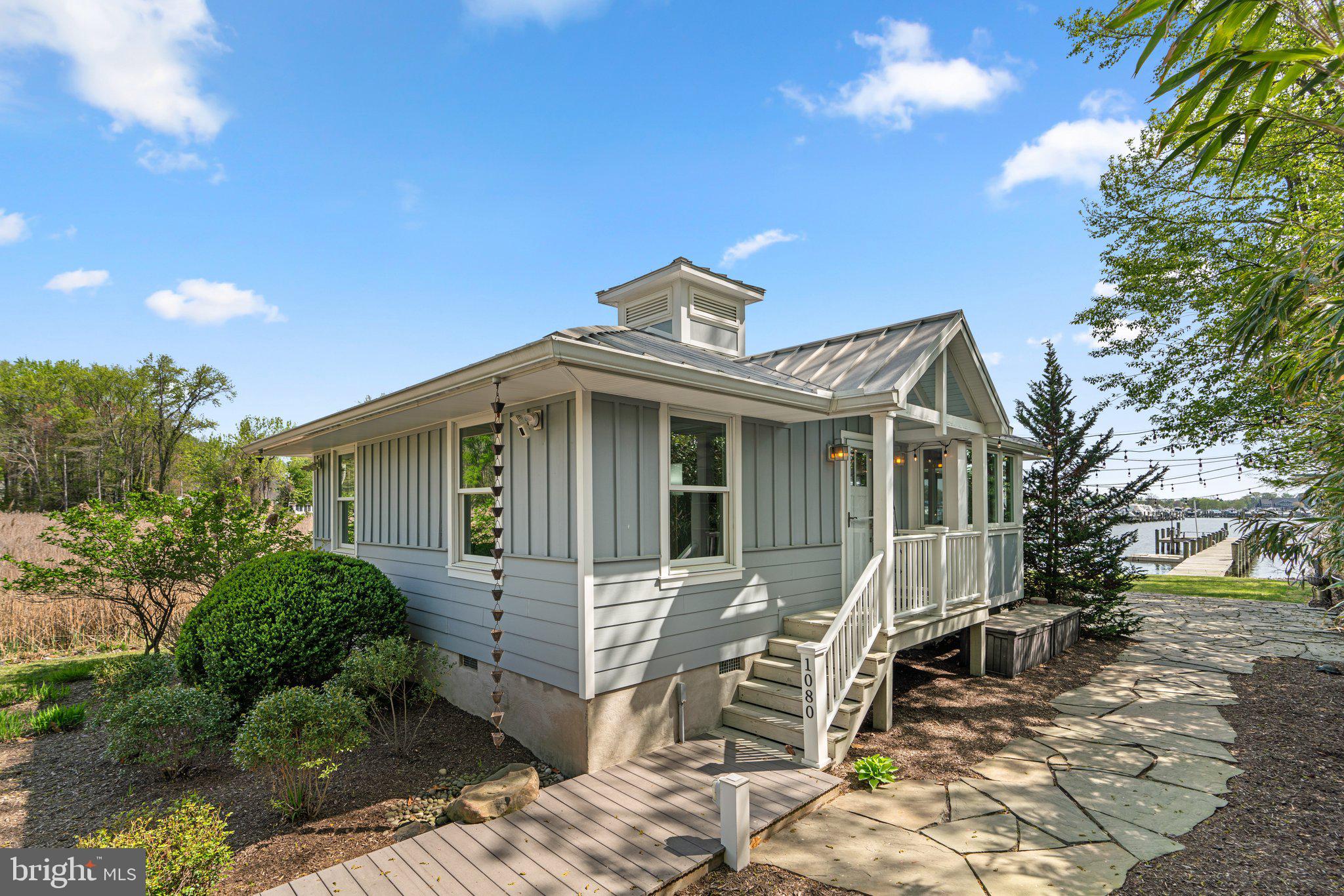 1080 Mayo Road Edgewater, MD 21037 - Photo 57 of 57 a front view of a house with a porch