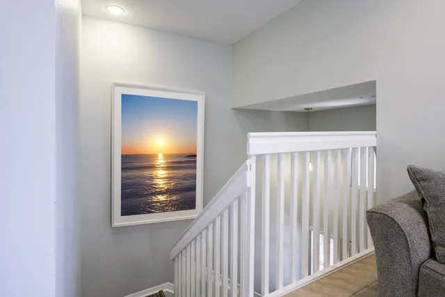 a view of room with window and wooden floor