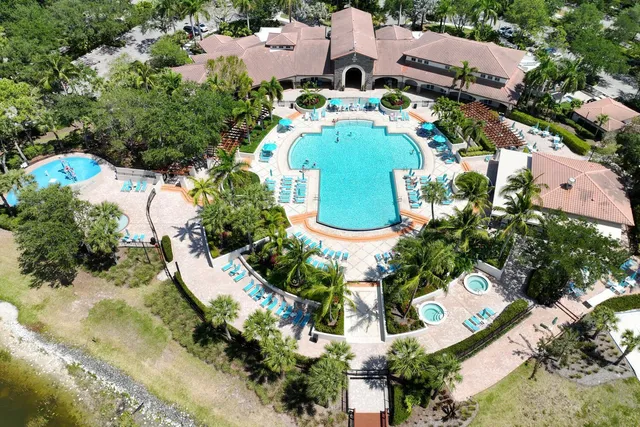 an aerial view of a house with a swimming pool