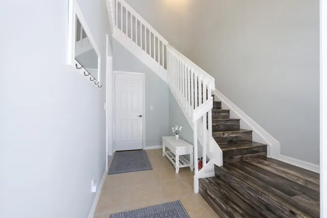 a view of entryway and hall with wooden floor
