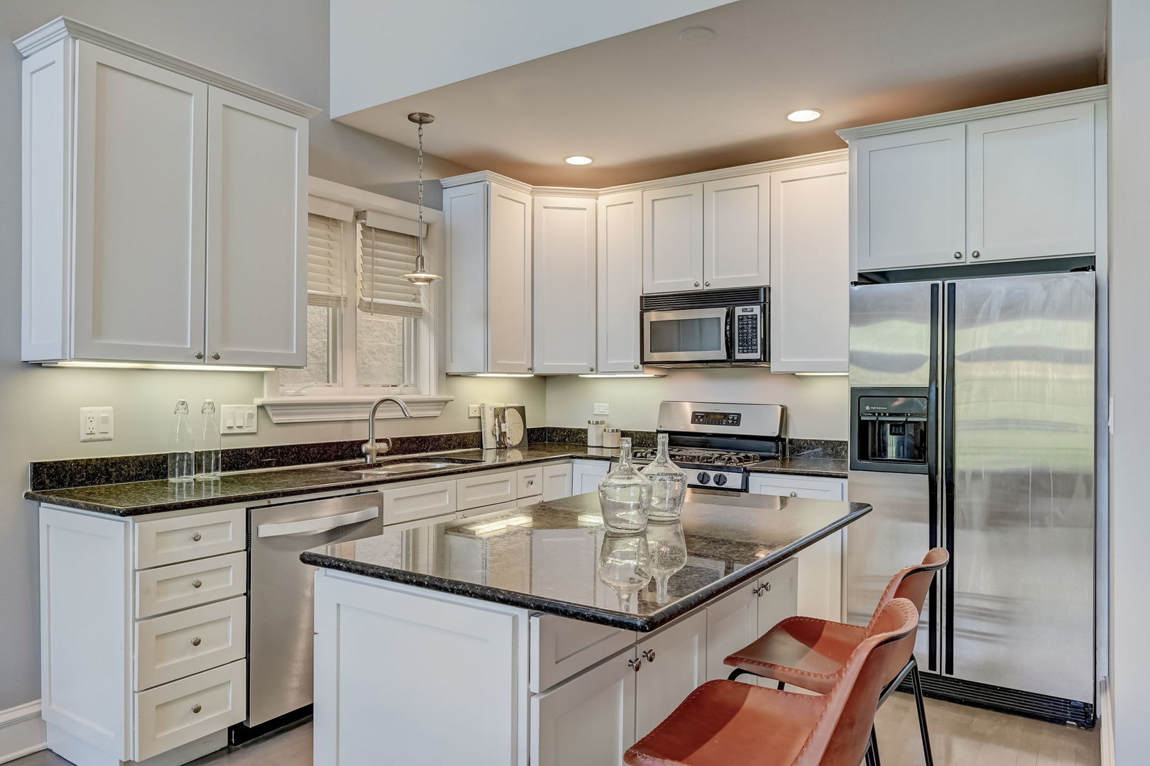1367 North Mohawk Street, Unit 3N Chicago, IL 60610 - Photo 11 of 37 a kitchen with white cabinets stainless steel appliances and a sink