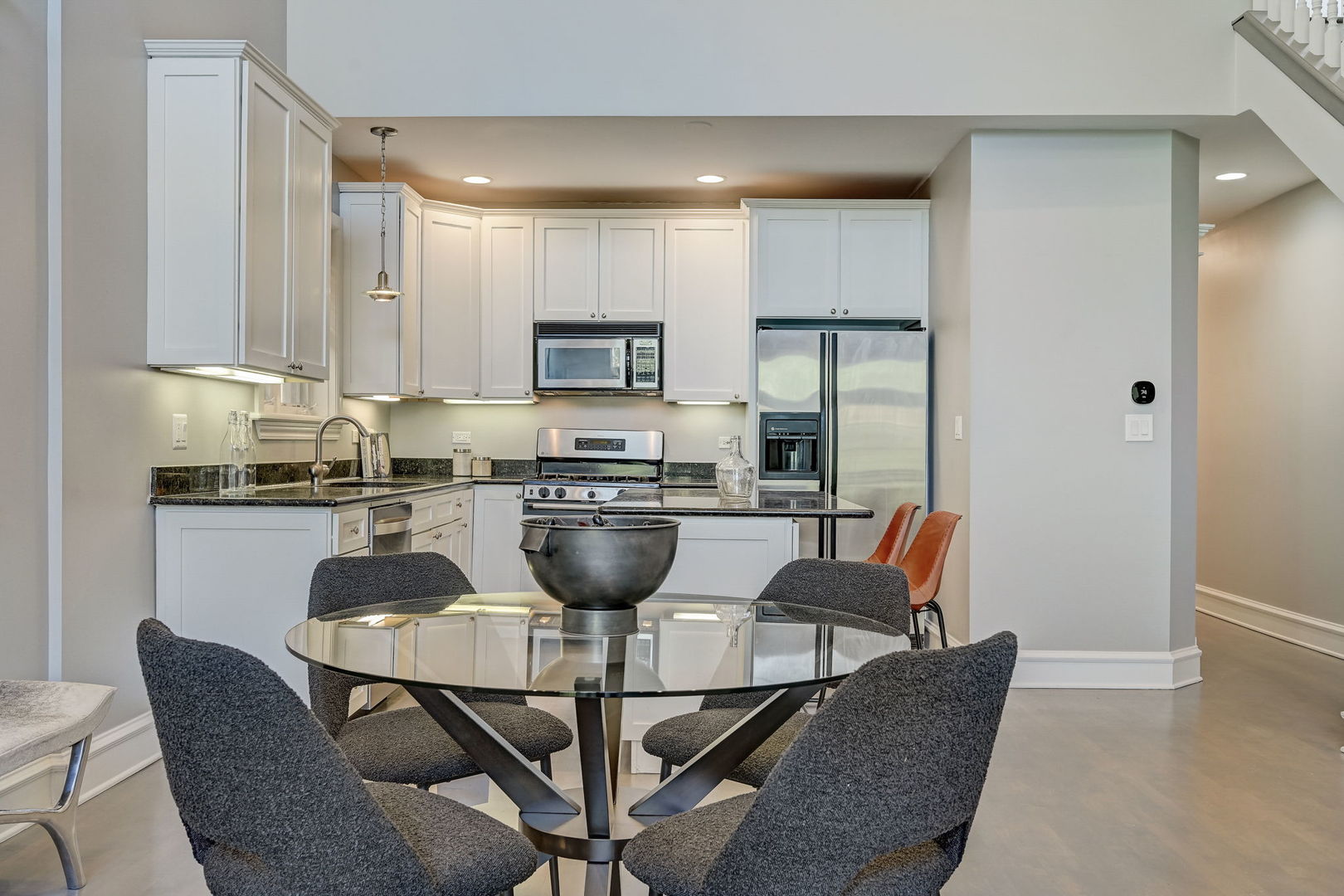 1367 North Mohawk Street, Unit 3N Chicago, IL 60610 - Photo 12 of 37 a kitchen with a dining table chairs and a refrigerator
