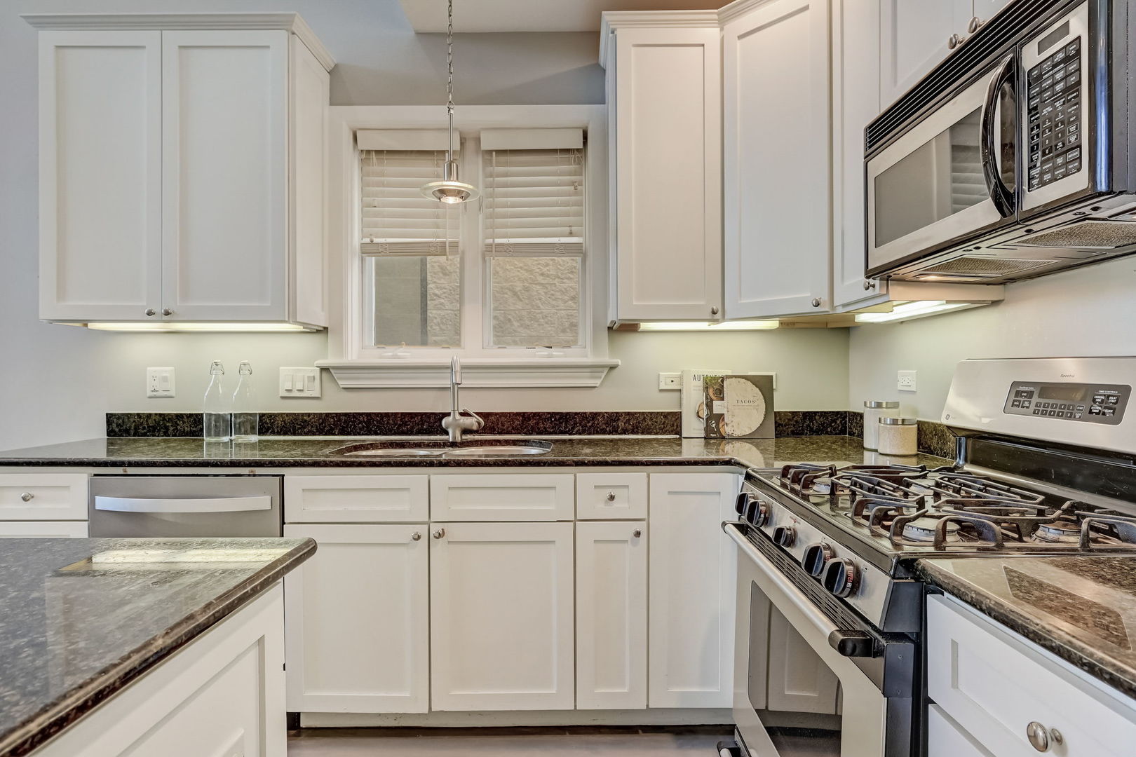 1367 North Mohawk Street, Unit 3N Chicago, IL 60610 - Photo 14 of 37 a kitchen with stainless steel appliances granite countertop a stove and a sink