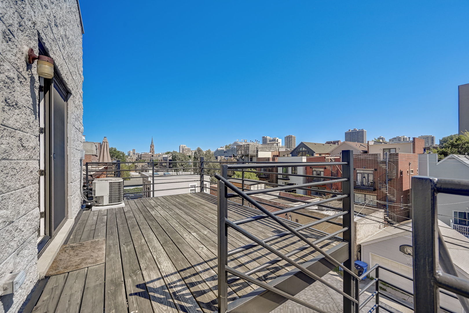 1367 North Mohawk Street, Unit 3N Chicago, IL 60610 - Photo 21 of 37 a view of a balcony with chairs and wooden floor