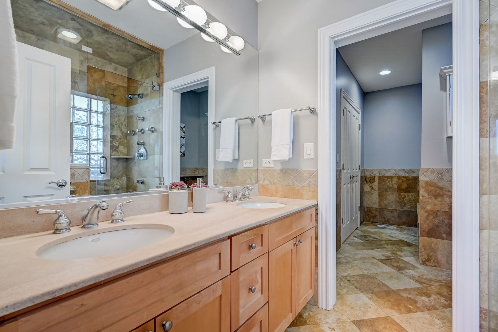 1367 North Mohawk Street, Unit 3N Chicago, IL 60610 - Photo 22 of 37 a bathroom with a sink double vanity and a shower