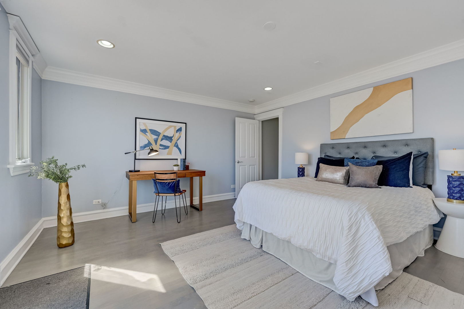 1367 North Mohawk Street, Unit 3N Chicago, IL 60610 - Photo 28 of 37 a bedroom with a bed and a chandelier
