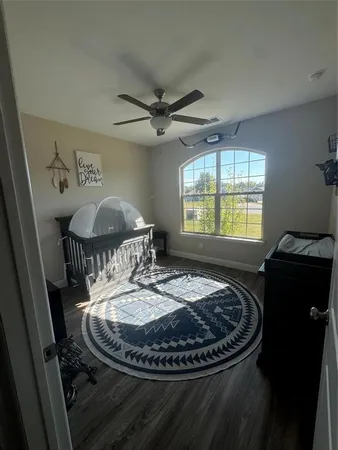 a table with chairs and a dining table with wooden floor