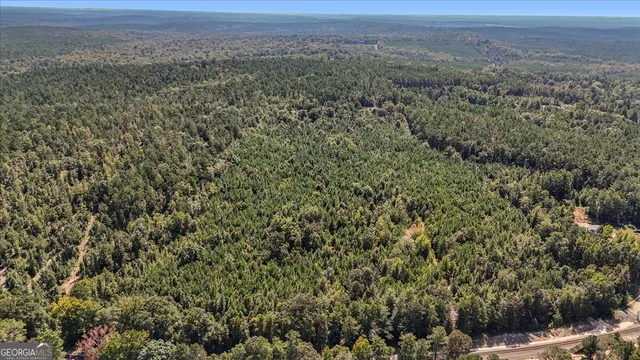 a view of a big yard with houses