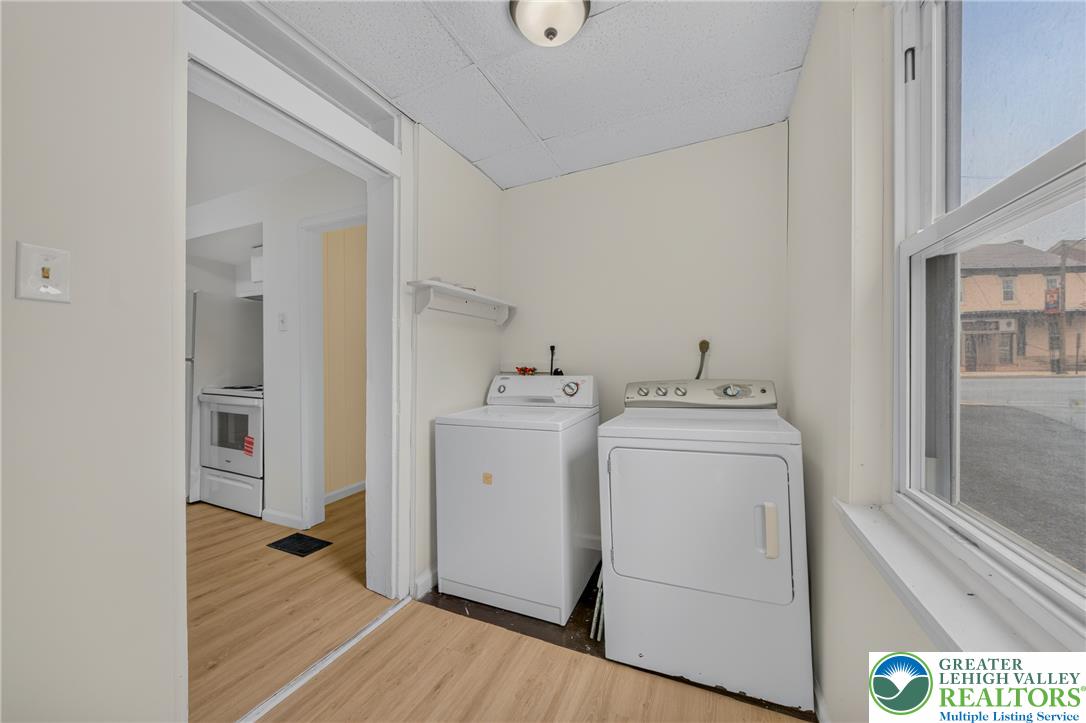 313 Main Street Slatington, PA 18080 - Photo 25 of 73 Functional laundry nook provides convenient in-home appliance access with an adjacent kitchen space.