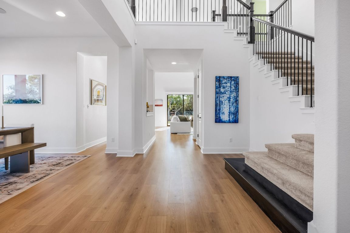 4612 Destination Way Jonestown, TX 78645 - Photo 11 of 37 workspace with wooden floor and windows