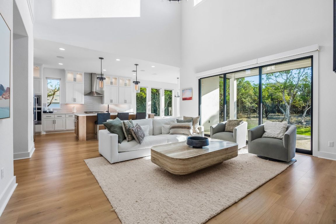 4612 Destination Way Jonestown, TX 78645 - Photo 13 of 37 a living room with furniture and a large window