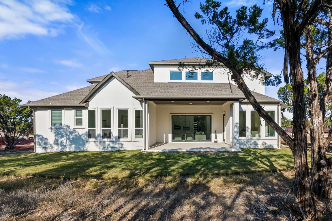 4612 Destination Way Jonestown, TX 78645 - Photo 14 of 37 a front view of a house with garden