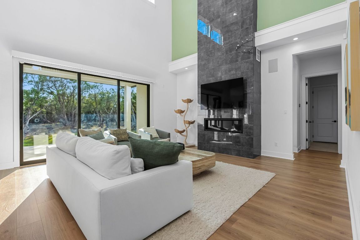 4612 Destination Way Jonestown, TX 78645 - Photo 17 of 37 a living room with furniture and a flat screen tv