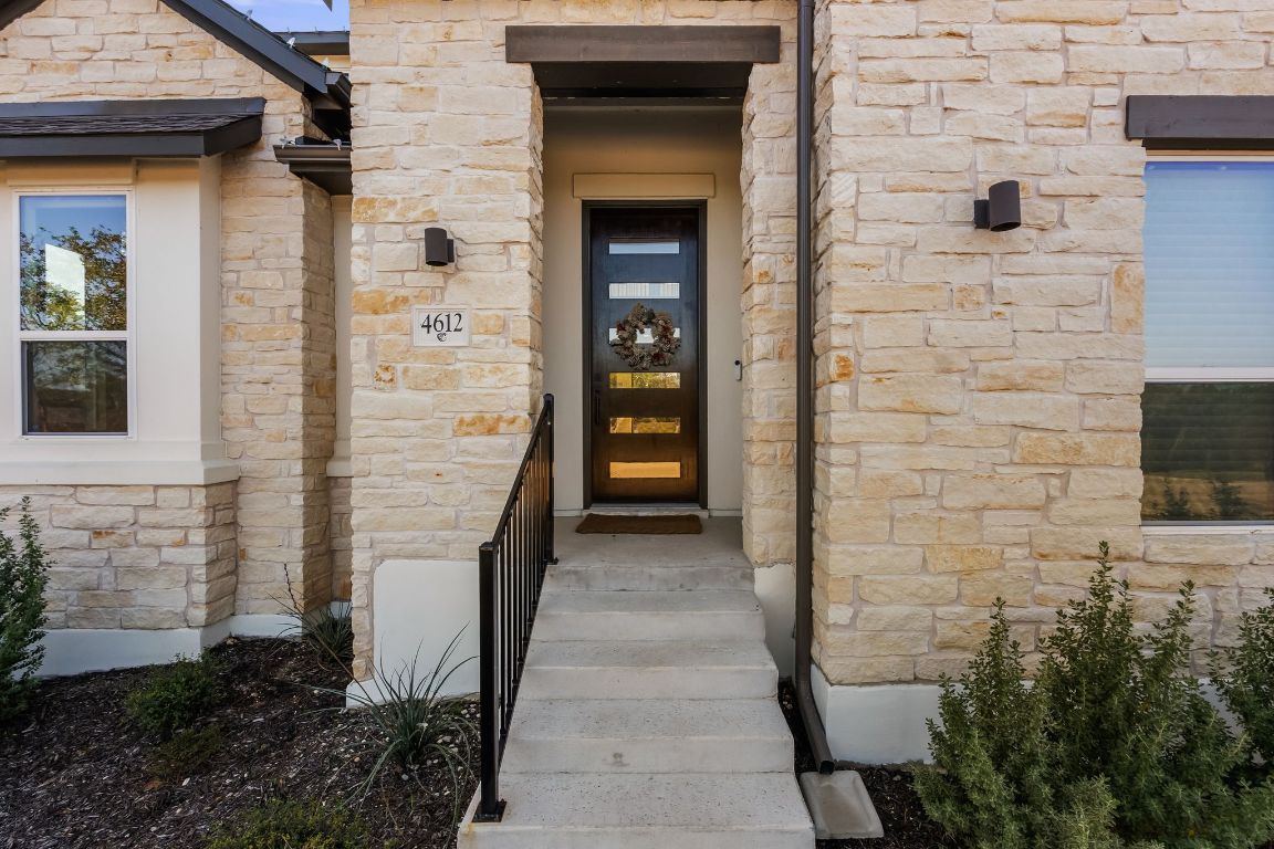 4612 Destination Way Jonestown, TX 78645 - Photo 2 of 37 a view of a pathway of a house and window