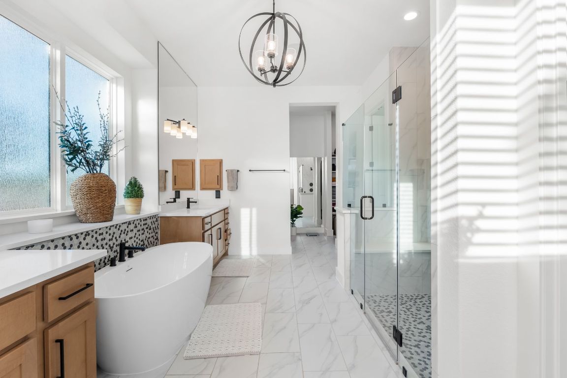 4612 Destination Way Jonestown, TX 78645 - Photo 21 of 37 a very nice looking room with a large window and chandelier