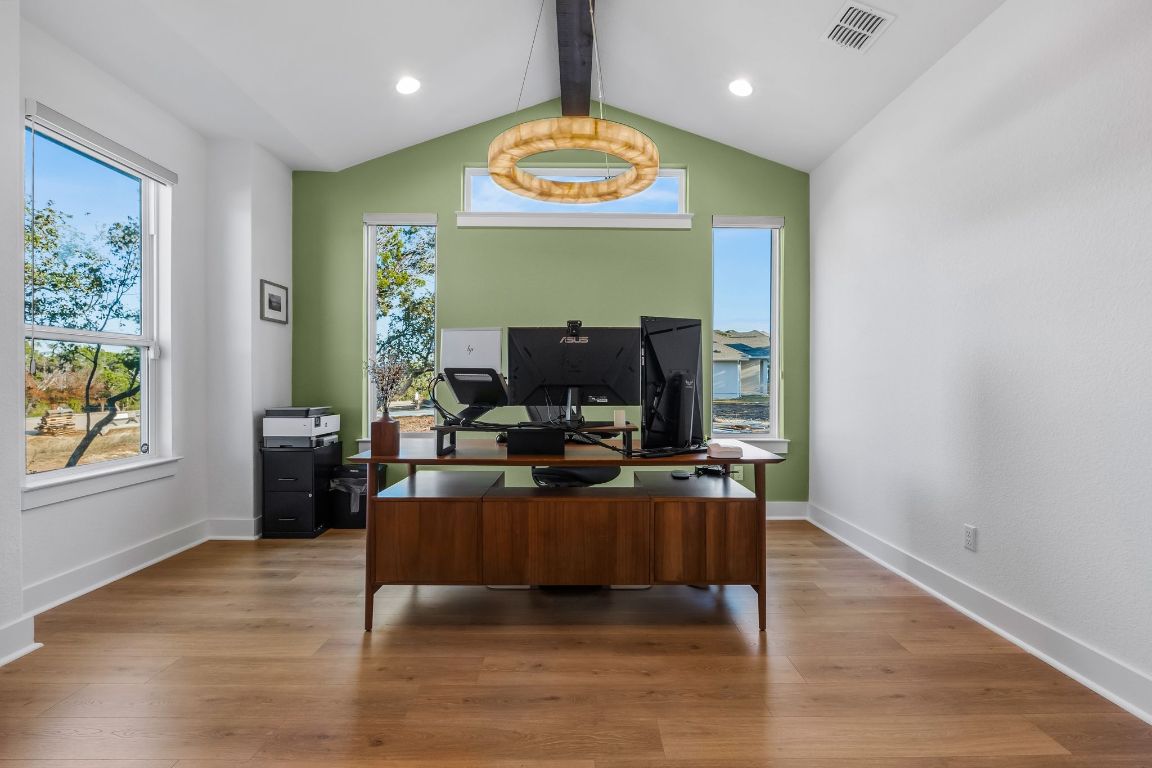 4612 Destination Way Jonestown, TX 78645 - Photo 26 of 37 a living room with furniture and a fireplace