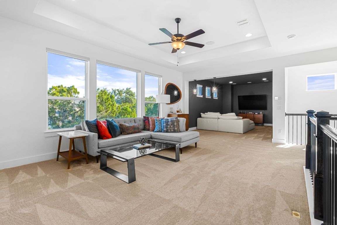 4612 Destination Way Jonestown, TX 78645 - Photo 28 of 37 a living room with furniture and a large window