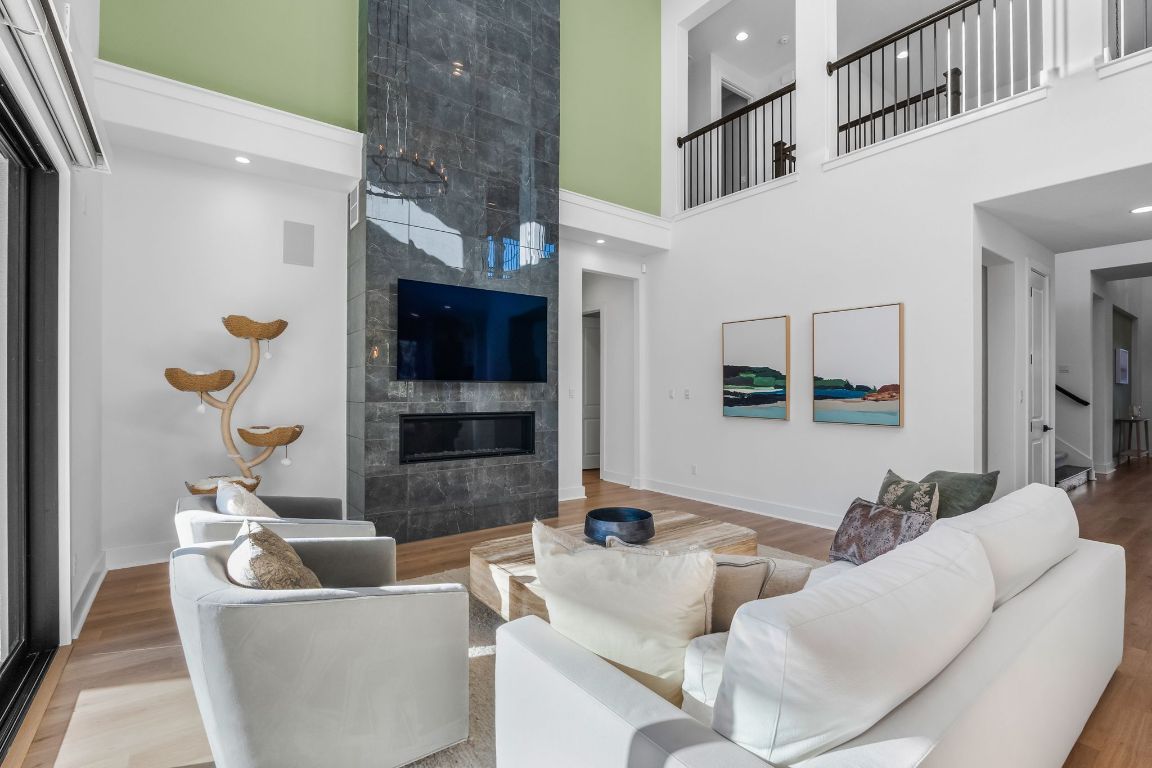 4612 Destination Way Jonestown, TX 78645 - Photo 3 of 37 a living room with furniture and a flat screen tv